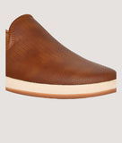 Brown perforated slip-on loafers for men, lightweight and breathable.