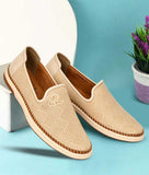 Men's ethnic loafer shoes in beige with slip-on design and synthetic leather material.