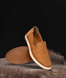 Men's stylish ethnic loafer shoes in brown synthetic leather with patterned upper and flat TPR sole, slip-on design for casual wear.